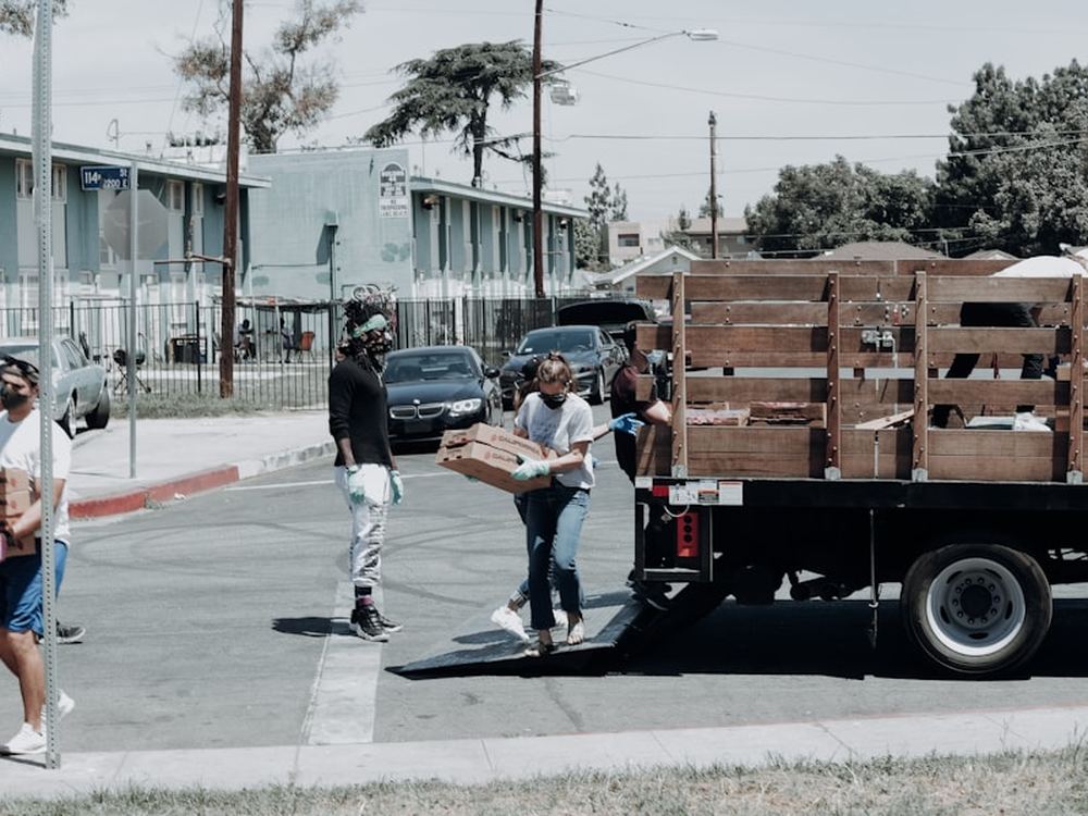 Community volunteers unloading donations at a neighbourhood food drive